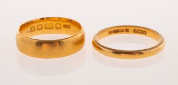 Two 22ct gold wedding bands, both UK hallmark, sizes H1/2 and J, total gross weight 7.1grams, (2).