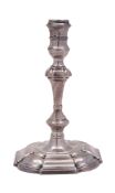 A George II cast silver taperstick, on square bases with rounded corners, a 