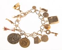 A heart bracelet with attached charms, an open heart link bracelet with safety chain,