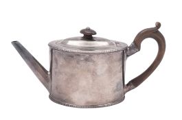 A George III silver tea pot, oval form, with bead borders,