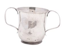 A George III silver porringer, of campana form, with twin, reeded handles and on a circular foot,