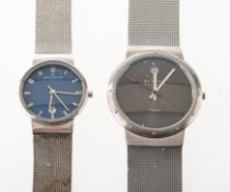 Two Skagen gentleman's wristwatches one having a grey dial with baton hands, sweep seconds hand,