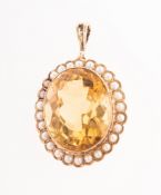A citrine and pearl pendant, of oval form, raised collet set with an oval mixed-cut citrine,