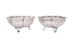 A pair of George V silver bonbon dishes, of hexafoil outline, with laurel borders,