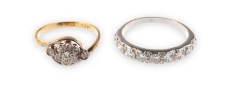 Two diamond set rings of varied design, including a half eternity ring,