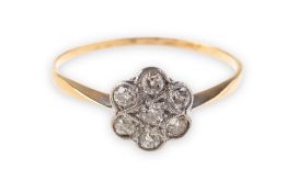 A diamond daisy cluster ring, set with seven old-cut diamonds, diamonds approx. 0.
