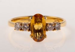 A yellow sapphire and diamond ring,