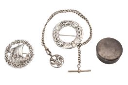 Two Scandinavian style silver brooches, both circular and decorated with Viking longships,