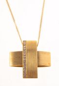 A modern 18ct gold and diamond cross pendant with chain,