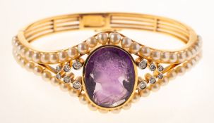 An impressive Continental carved amethyst, diamond and pearl bangle,