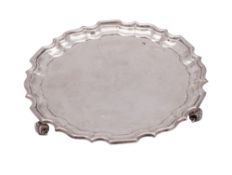 An Edwardian silver waiter, of shaped circular outline,