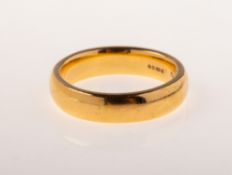 A 22ct gold wedding band, UK hallmark, 916, size M1/2, 9.4grams.