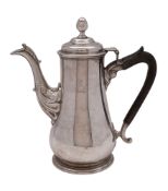 An 18th century Irish silver coffee pot, of baluster form, with an acorn finial,