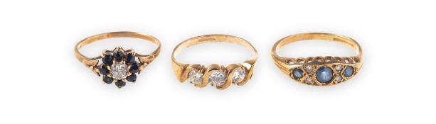 Three varied design 9ct gold rings, including a 9ct gold twist designed ring,