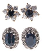 Two pairs of sapphire stud earrings of varied design
