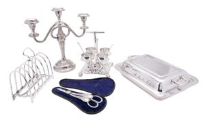 A small quantity of silver plated wares, to include an egg cruet, a candelabrum, a toast rack,