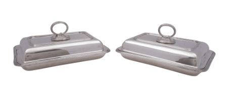 A pair of George V silver entreé dishes & covers, of rounded rectangular form,