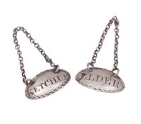 A George III matched pair of silver sauce labels, oval form,