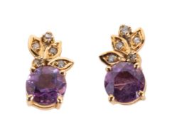 A pair of amethyst and diamond earrings, of foliate form, each set to the top with a leaf formation,