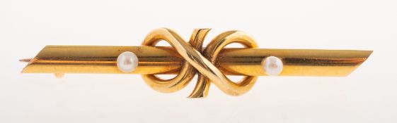 A pearl brooch, a bar brooch with a central knot design, set with two small pearls,