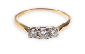 A three stone diamond ring, set with three old-cut diamonds in square style settings,