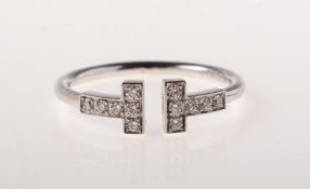 Tiffany, an 18ct white gold Tiffany T diamond wire ring,