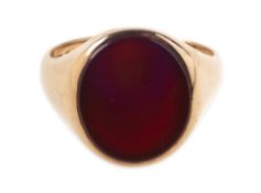 Cropp & Farr, a 1950's 9ct gold carnelian signet ring, set with an oval plaque of carnelian,