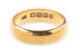An 18ct yellow gold wedding band, UK hallmark, width of band approx. 5.5mm, 6.