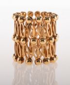 An unusual vintage 9ct gold ring bracelet, of openwork fretwork design,