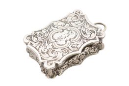 A Victorian silver vinaigrette, of shaped rectangular form, with an applied suspensory ring,