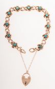 An early 20th century turquoise set bracelet, of curb links,