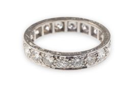 An Art Deco full diamond eternity ring, grain set with eighteen brilliant-cut diamonds,