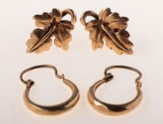 Two pairs of varied design stud earrings, including a pair of 'gypsy' style hoop earrings,