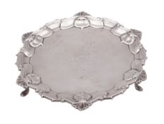 An Edwardian silver waiter, of shaped circular outline,