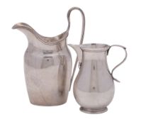 An early Elizabeth II silver cream jug, baluster form,