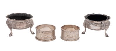 A pair of late Victorian silver salts, shaped circular outline, with textured borders,