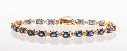 A sapphire and diamond bracelet, the articulated bracelet is made up of 'X' style links,