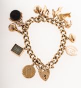 A 9ct gold charm bracelet with eleven charms,