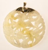 A faux 'jade' carved pendant, the carved and pierced faux 'jade' depicts a mythical horse figure,