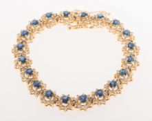 A sapphire and diamond bracelet, of flowerhead form,