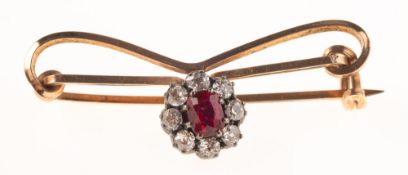 A Victorian ruby and diamond brooch, the brooch of ribbon form with a detachable flowerhead cluster,