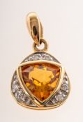 An 18ct gold citrine and diamond pendant, of triangular form,