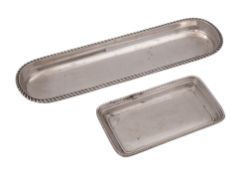 A George V dressing table tray, of rounded oblong form, with a gadroon border,