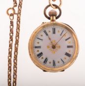A lady's 14k gold open faced pocket watch the case stamped 14K with a gilt-brass inner cuvee,