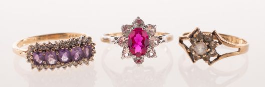 Three dress rings of varied design,