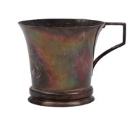 A George V Art-Deco silver christening mug, of campana form and with an angular handle, inscribed,