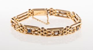 An early 20th century sapphire and pearl bracelet, of gate link style,
