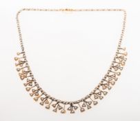 A Victorian seed pearl fringe necklace, designed as a continuous line of collet set seed pearls,