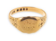 A 1940's 18ct gold signet ring, indistinct engraving to the shield, carved shoulders, (faint),