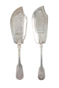 Two Victorian silver fish slices, both with pierced blades & crested, one in Fiddle pattern,